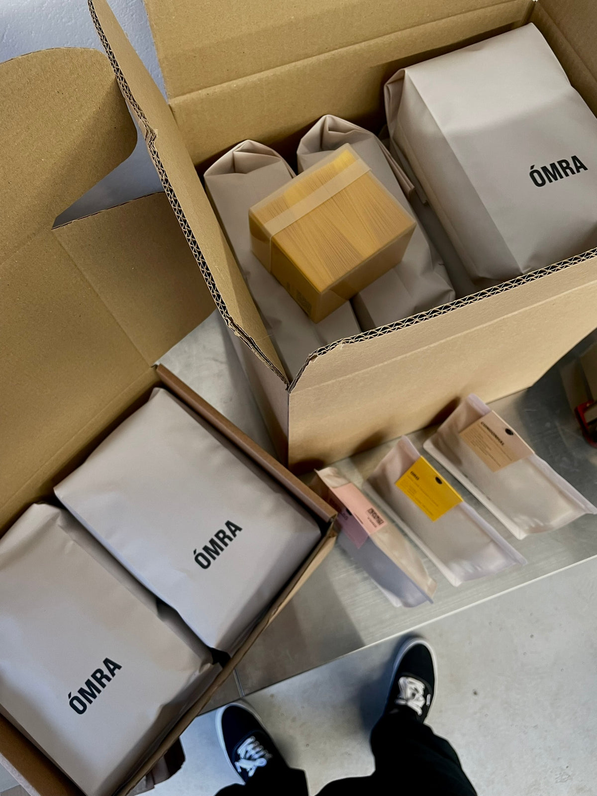 Fresh coffee orders packed at Ómra’s roastery