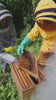 Beekeepers working with a hive frame.